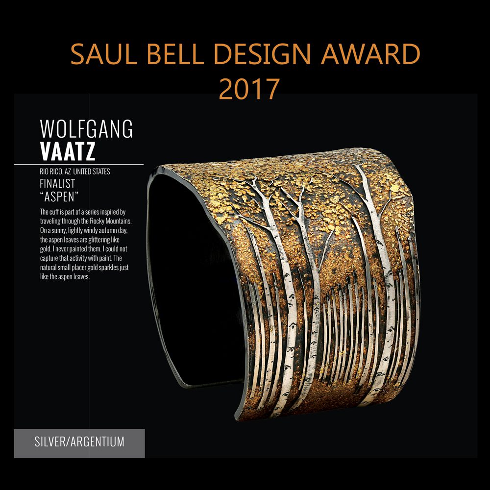 A black and gold cuff with the name of wolfgang vaatz