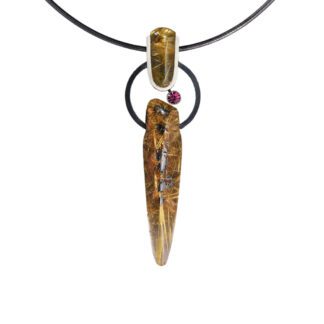 A necklace with a wooden piece of wood and a red stone.