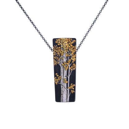 A rectangular pendant with gold leaf on it.