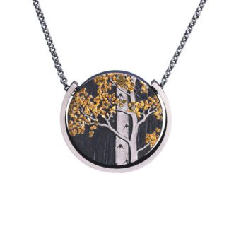 A necklace with a tree on it