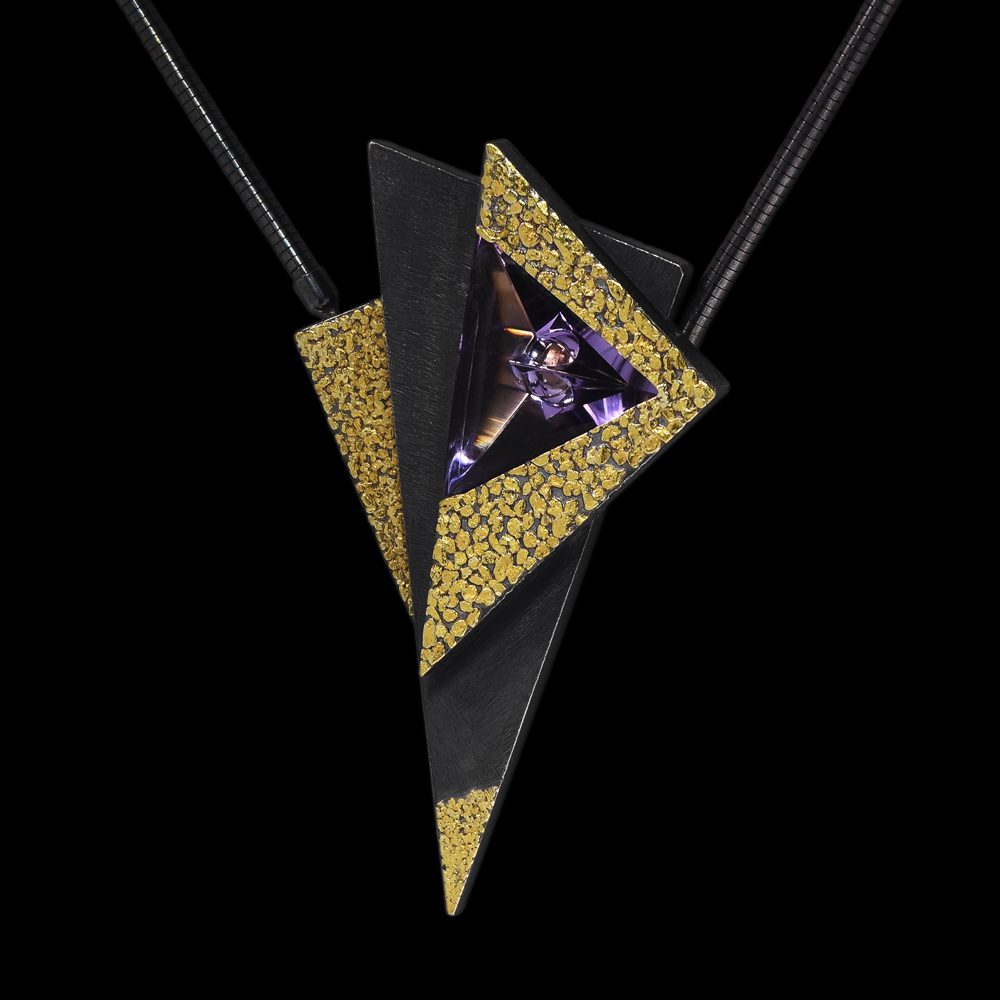A black and gold triangle shaped necklace with a purple diamond.