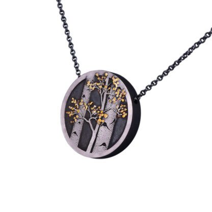 A necklace with a tree on it