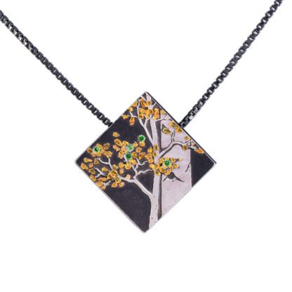 A necklace with a square shaped pendant on it.