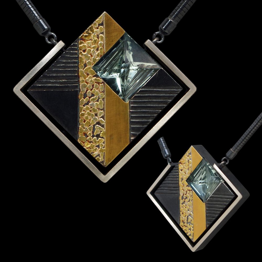 A square shaped necklace with gold and black accents.