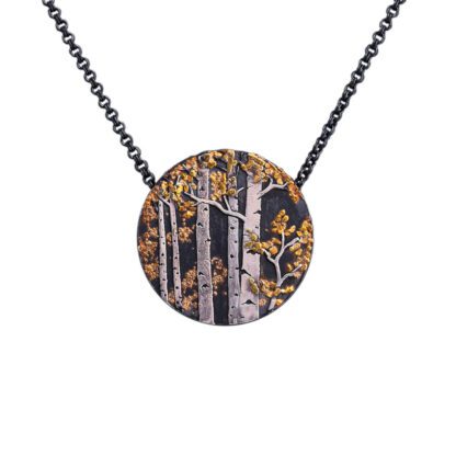 A necklace with a round pendant on it.