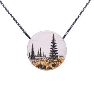 A necklace with trees and mountains painted on it.