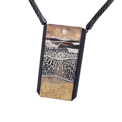 A necklace with a picture of a leopard print.
