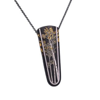 A necklace with a black and gold design on it.