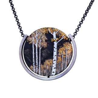 A necklace with trees in the middle of it