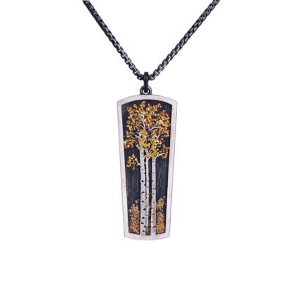 A rectangular pendant with trees on it.