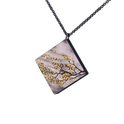 A square shaped necklace with yellow flowers on it.