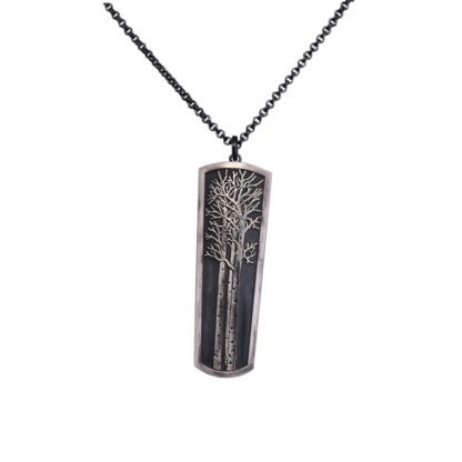 A silver necklace with a rectangular shaped pendant.
