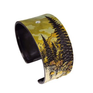 A yellow and black cuff bracelet with trees