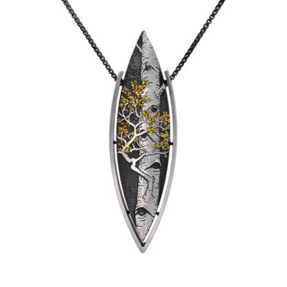 A silver and gold leaf pendant on a black cord.