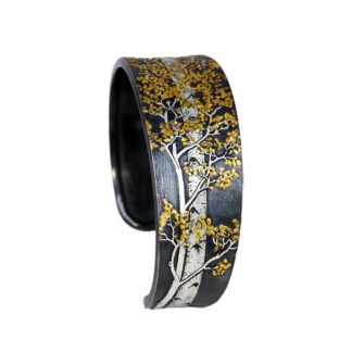 A black and white bracelet with yellow trees