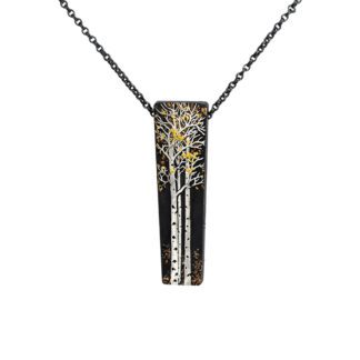 A black and white necklace with gold accents.