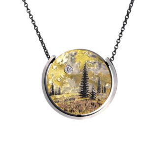 A necklace with trees and clouds on it.