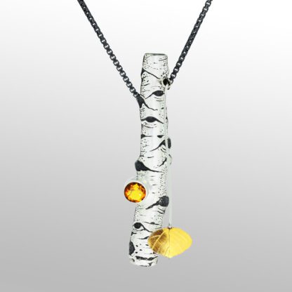 A long glass necklace with a yellow flower on it.