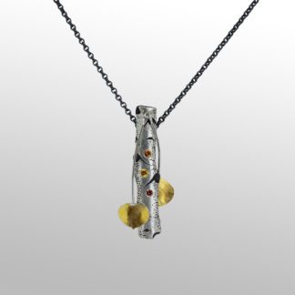 A necklace with two yellow beads hanging from it.