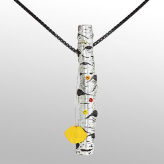 A long necklace with a yellow pendant and black and white design.