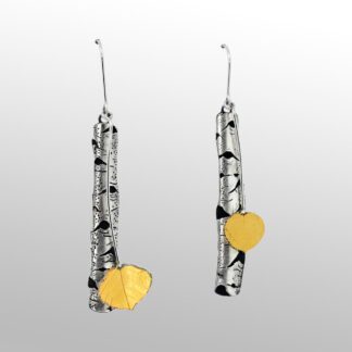 A pair of earrings with silver and yellow metal.