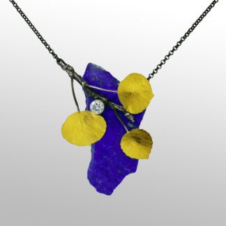 A necklace with blue and yellow leaves on it.