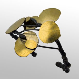 A metal sculpture of flowers with gold leaves.