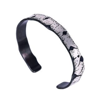A black and white bracelet is shown.