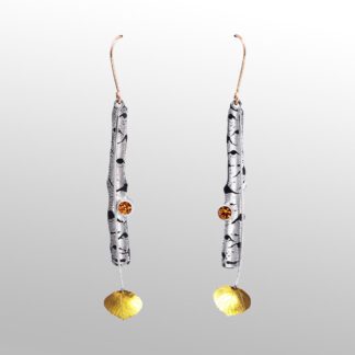 A pair of long earrings with gold and silver beads.