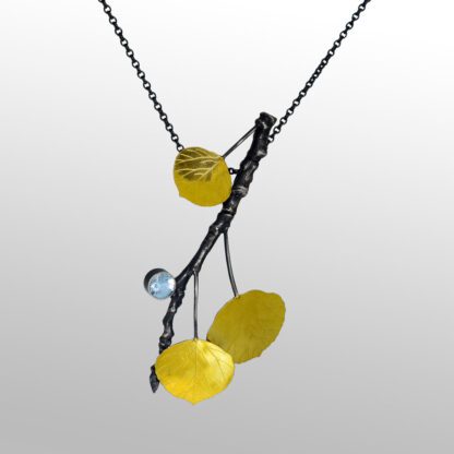 A necklace with yellow and black beads on it.