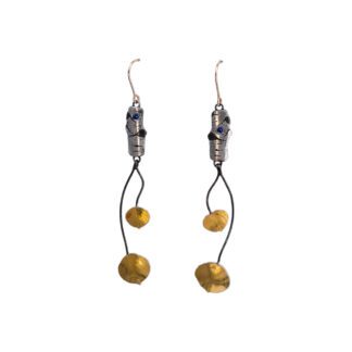A pair of earrings with gold beads hanging from them.