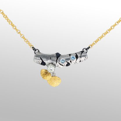 A necklace with two bears on it