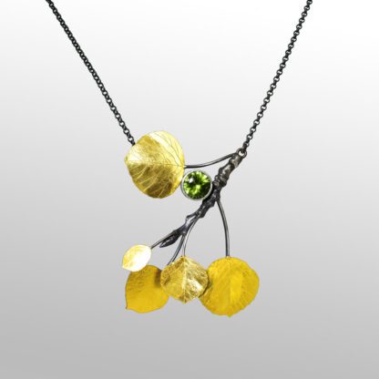 A necklace with yellow flowers and green beads.