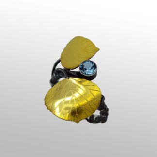 A yellow shell with a blue stone on it.
