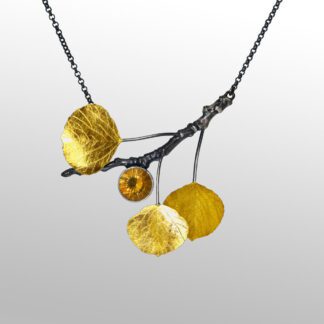 A necklace with three yellow flowers on it.
