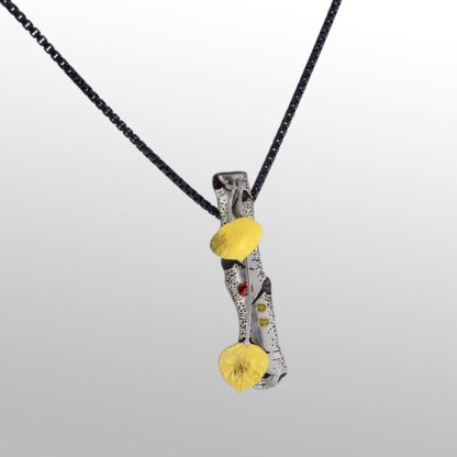 A yellow and silver necklace with black cord.