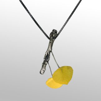 A yellow necklace hanging from a silver chain.